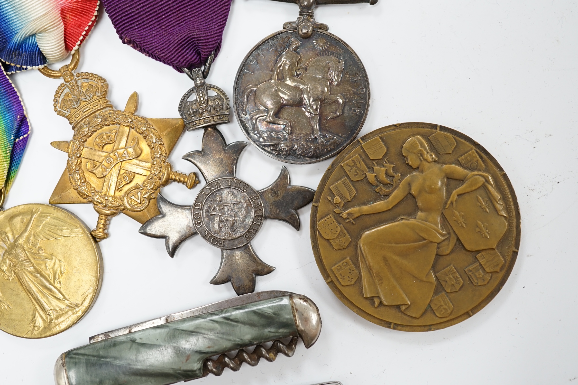 A First World War medal group awarded to Pte. G. Legh-Jones 1/28 London Regiment, comprising; an OBE with First War trio, together with a French Line ‘Ile de France’ commemorative medallion and two penknives. Condition -